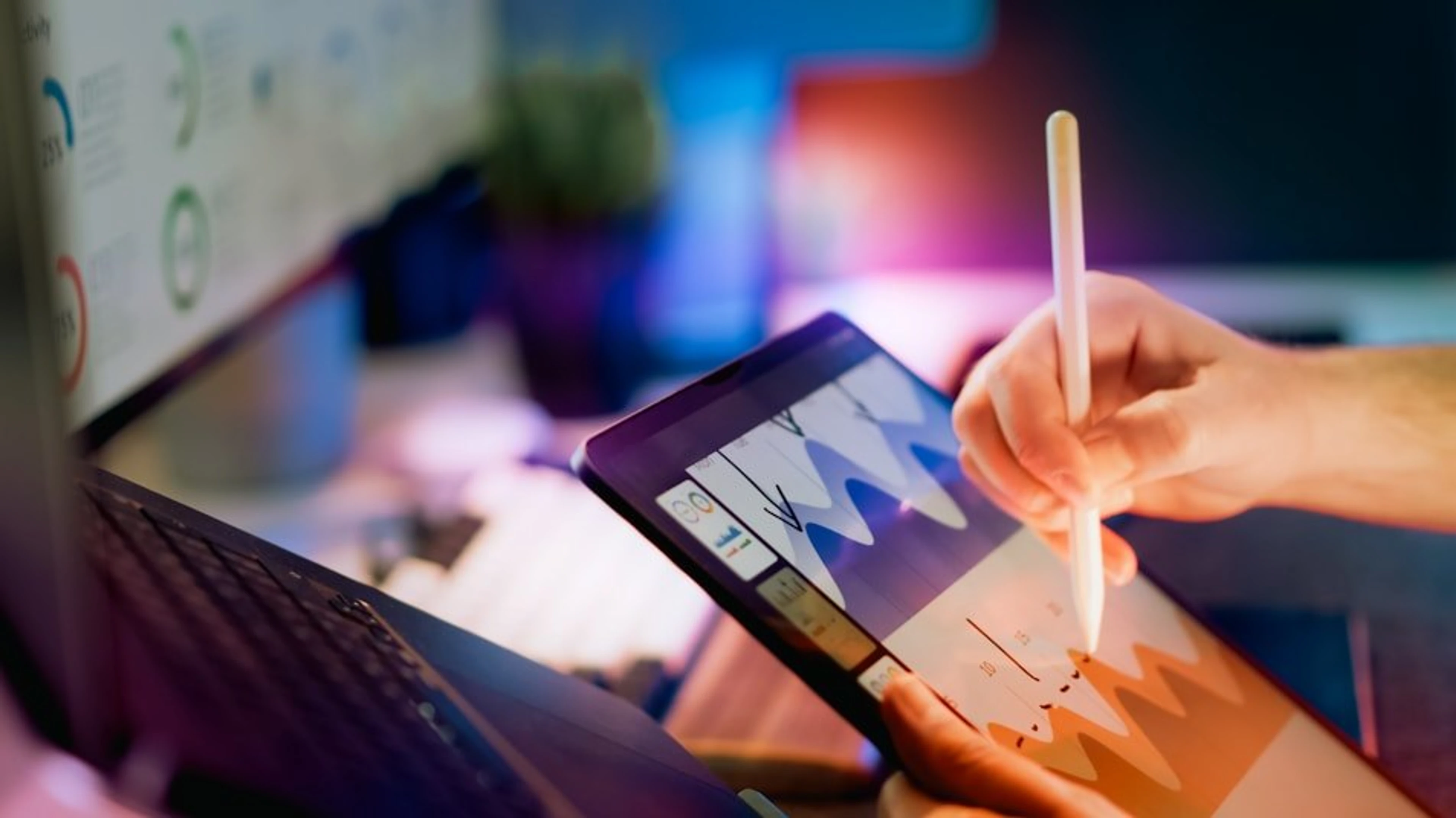 Hand drawing a chart on a tablet