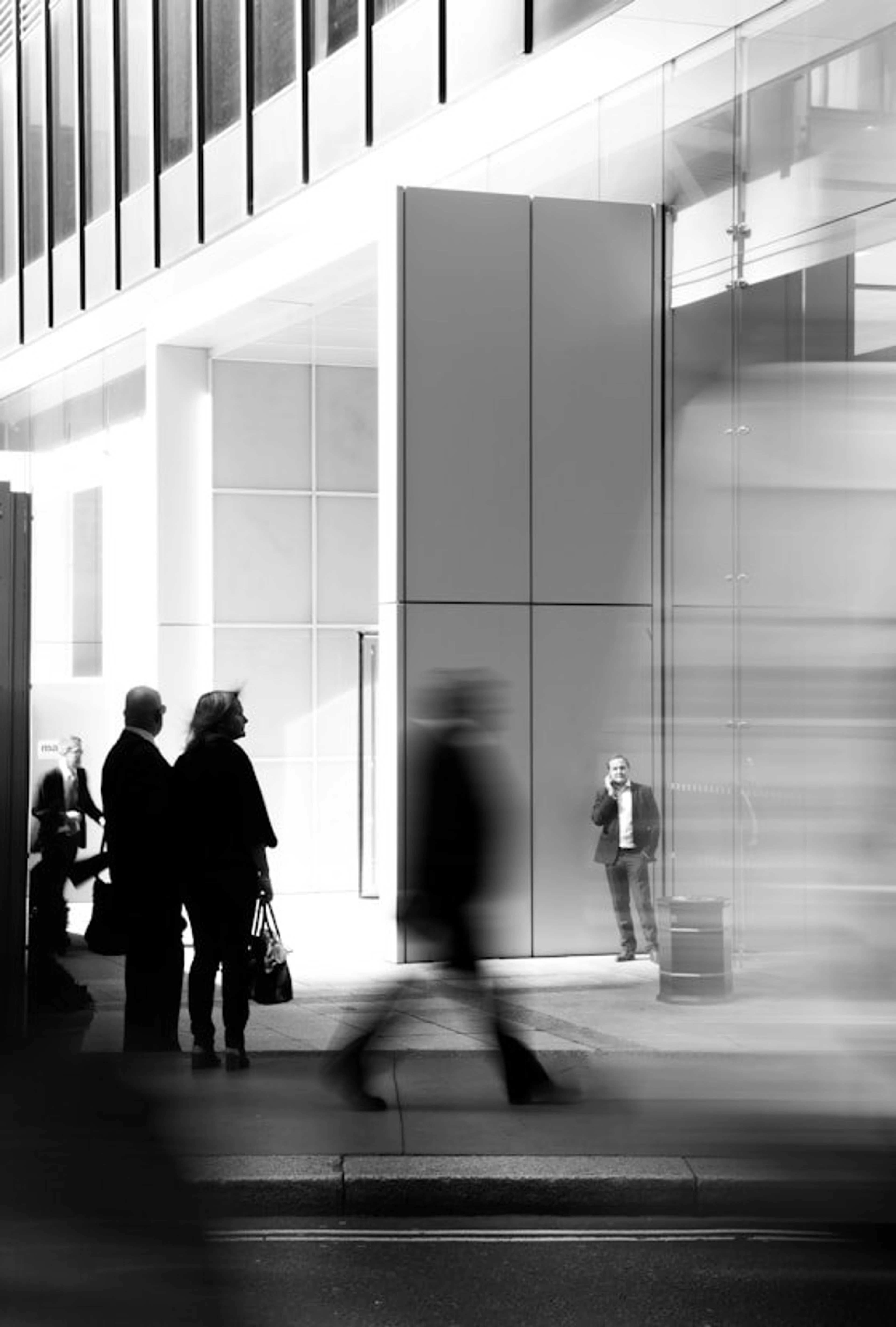 People walking through an office lobby