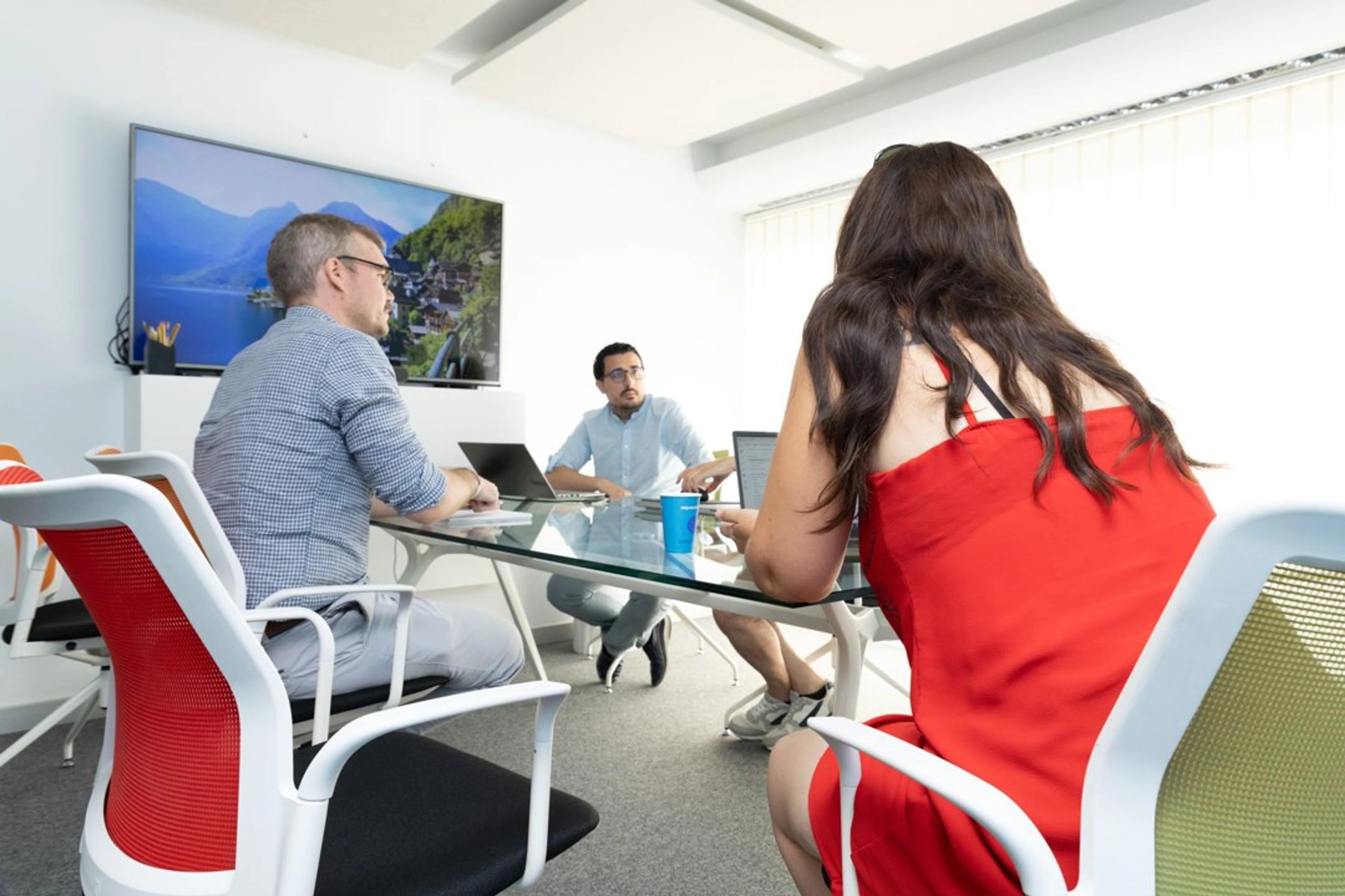Team meeting around a glass table
